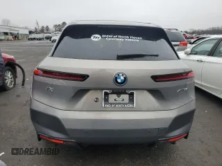 2023 BMW iX xDrive50 with VIN WB523CF03PCM84985, listed as a Copart auction lot 44174314 with 2,220 mi miles. Bid and sale history available at carsss.com. Image 6.