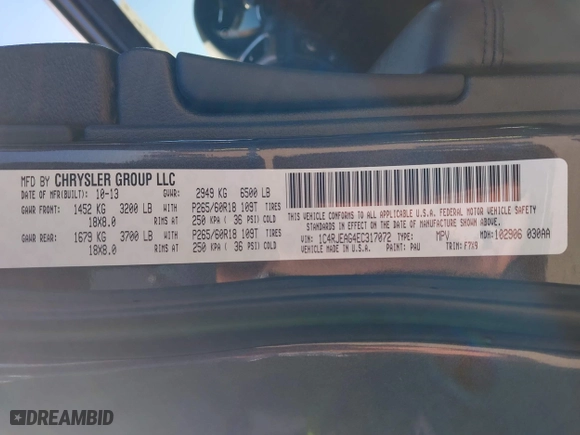2014 Jeep Grand Cherokee Laredo with VIN 1C4RJEAG4EC317072, listed as a IAAI auction lot 41476862 with 127,742 mi miles. Bid and sale history available at carsss.com. Image 9.