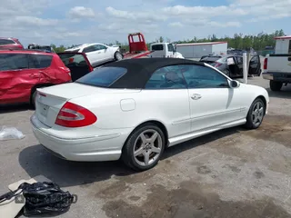 2005 Mercedes-Benz CLK 5.0L with VIN WDBTK75J55F123328, listed as a IAAI auction lot 42082590 with 58,969 mi miles. Bid and sale history available at carsss.com. Image 4.