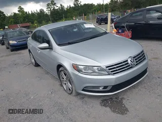 2014 Volkswagen CC Sport with VIN WVWBN7AN8EE500804, listed as a IAAI auction lot 42667060 with 213,893 mi miles and . Bid and sale history available at DreamBid. Image 1.
