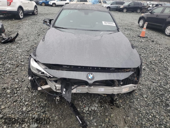 2015 BMW M4 with VIN WBS3R9C54FK330180, listed as a Copart auction lot 40706044 with 69,474 mi miles. Bid and sale history available at carsss.com. Image 5.
