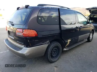 2002 Toyota Sienna LE with VIN 4T3ZF13CX2U457768, listed as a Copart auction lot 84763284 with 195,268 mi miles and Salvage Title. Bid and sale history available at carsss.com. Image 3.