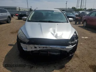 2017 Ford Focus SE with VIN 1FADP3FE7HL290271, listed as a Copart auction lot 60665615 with 130,409 mi miles and Salvage title. Bid and sale history available at DreamBid. Image 5.