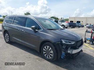 2023 Chrysler Pacifica Hybrid Touring L with VIN 2C4RC1L74PR579782, listed as a IAAI auction lot 42487390 with Not provided miles and . Bid and sale history available at DreamBid. Image 1.