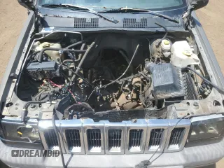 1997 Jeep Grand Cherokee Laredo z VIN 1J4GZ58S6VC636803, wystawiony jako Copart lot #59977115 z przebiegiem Nie podano mil oraz Szkoda całkowita • Salvage title. Historia ofert i sprzedaży dostępna na DreamBid. Obrazek 12.
