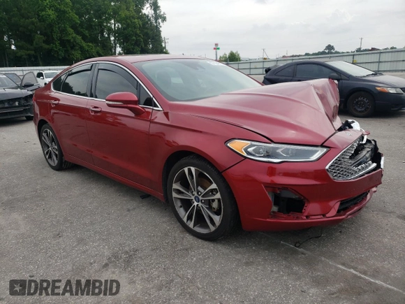 2019 Ford Fusion Titanium z VIN 3FA6P0D99KR221328, wystawiony jako Copart lot #57104515 z przebiegiem 138 427 mil mil oraz Szkoda całkowita • Salvage title. Historia ofert i sprzedaży dostępna na DreamBid. Obrazek 4.