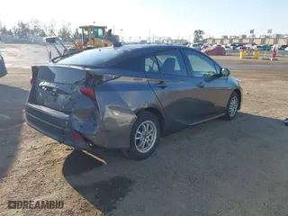 2020 Toyota Prius L Eco with VIN JTDKARFUXL3117737, listed as a IAAI auction lot 41988550 with 64,865 mi miles. Bid and sale history available at carsss.com. Image 4.