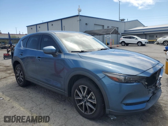 2018 Mazda CX-5 Grand Touring with VIN JM3KFBDM3J0323211, listed as a Copart auction lot 61166735 with Not provided miles and Salvage title. Bid and sale history available at DreamBid. Image 4.