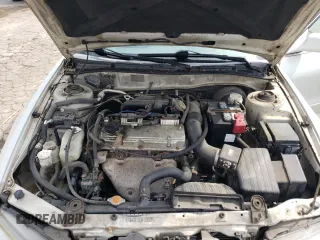 2002 Mitsubishi Galant ES z VIN 4A3AA46G12E124150, wystawiony jako Copart lot #60691994 z przebiegiem 113 597 mil mil oraz Szkoda całkowita • Salvage title. Historia ofert i sprzedaży dostępna na DreamBid. Obrazek 11.