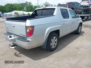 2006 Honda Ridgeline RTL with VIN 2HJYK16566H550339, listed as a IAAI auction lot 42223323 with 240,372 mi miles and . Bid and sale history available at DreamBid. Image 4.