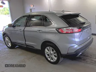 2020 Ford Edge Titanium z VIN 2FMPK4K91LBA91290, wystawiony jako IAAI lot #42494043 z przebiegiem 71 254 mil mil oraz . Historia ofert i sprzedaży dostępna na DreamBid. Obrazek 4.