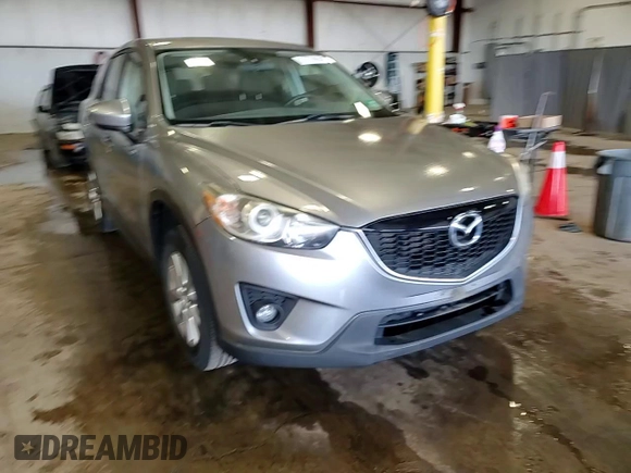 2014 Mazda CX-5 Touring z VIN JM3KE4CY5E0393463, wystawiony jako Copart lot #57776665 z przebiegiem 91 565 mil mil oraz Szkoda całkowita • Salvage title. Historia ofert i sprzedaży dostępna na DreamBid. Obrazek 13.
