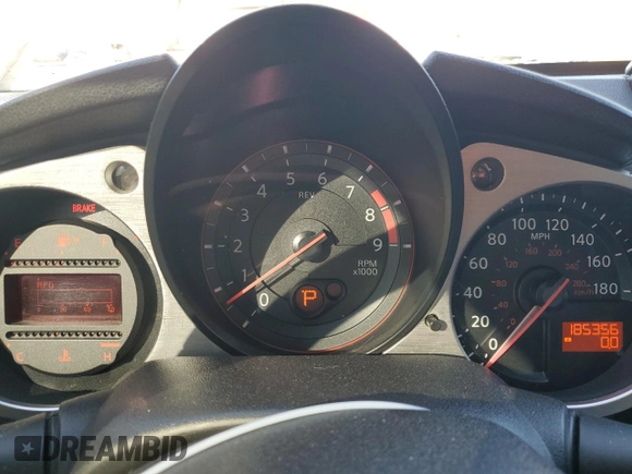 2014 Nissan 370Z Nismo with VIN JN1AZ4EH0EM635111, listed as a Copart auction lot 87292134 with 185,356 mi miles and Salvage Title. Bid and sale history available at DreamBid. Image 9.