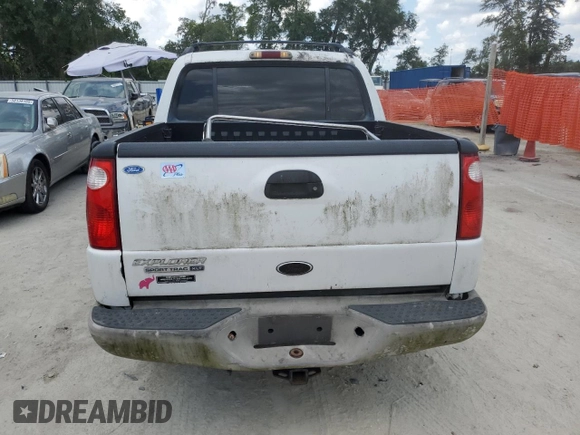 2003 Ford Explorer Sport Trac XLS with VIN 1FMZU67E43UB37127, listed as a Copart auction lot 58377075 with 219,033 mi miles and Salvage title. Bid and sale history available at DreamBid. Image 6.