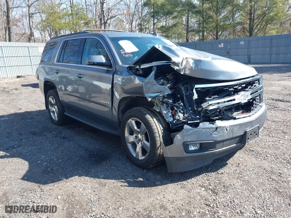 2019 Chevrolet Tahoe LT with VIN 1GNSKBKC0KR121493, listed as a IAAI auction lot 41656734 with 163,994 mi miles. Bid and sale history available at carsss.com. Image 1.