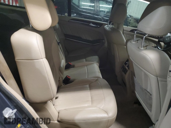 2014 Mercedes-Benz GL 450 z VIN 4JGDF7CE1EA311613, wystawiony jako Copart lot #52624995 z przebiegiem 134 404 mil mil oraz Tytuł czysty. Historia ofert i sprzedaży dostępna na DreamBid. Obrazek 11.