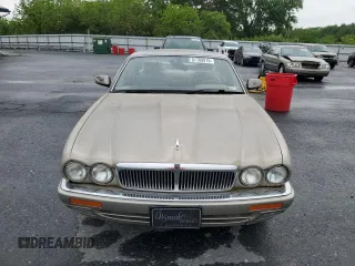 1995 Jaguar XJ with VIN SAJHX174XSC738856, listed as a Copart auction lot 57768915 with Not provided miles and Salvage title. Bid and sale history available at DreamBid. Image 5.