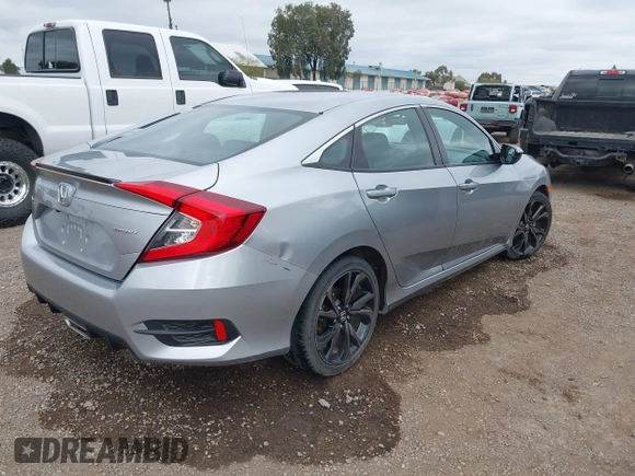 2021 Honda Civic Sport with VIN 2HGFC2F83MH510243, listed as a IAAI auction lot 41856857 with 95,739 mi miles and . Bid and sale history available at DreamBid. Image 4.