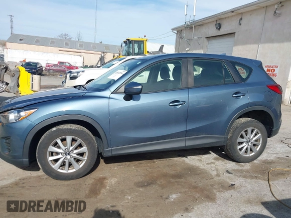 2016 Mazda CX-5 Sport with VIN JM3KE4BY0G0746034, listed as a IAAI auction lot 41842894 with 92,801 mi miles. Bid and sale history available at carsss.com. Image 14.