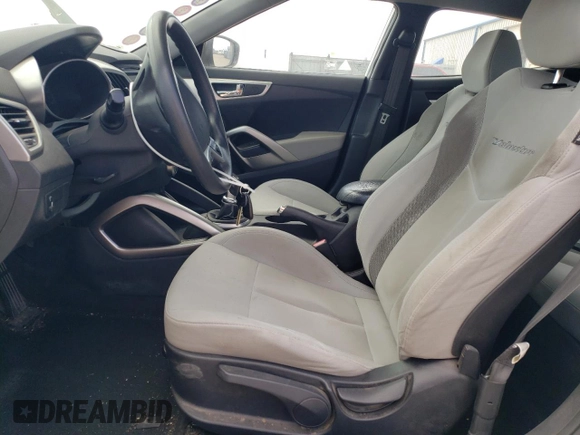 2013 Hyundai Veloster w/Black Int z VIN KMHTC6AD3DU085015, wystawiony jako Copart lot #54473595 z przebiegiem 158 966 mil mil oraz Szkoda całkowita • Salvage title. Historia ofert i sprzedaży dostępna na DreamBid. Obrazek 7.