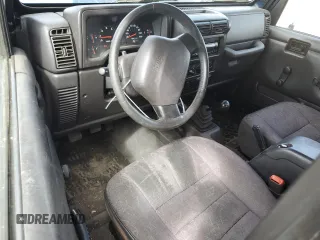 2002 Jeep Wrangler Sport z VIN 1J4FA49SX2P772609, wystawiony jako Copart lot #55893425 z przebiegiem 157 653 mil mil oraz Szkoda całkowita • Salvage title. Historia ofert i sprzedaży dostępna na DreamBid. Obrazek 8.