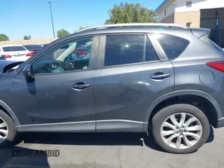 2014 Mazda CX-5 Grand Touring with VIN JM3KE4DY8E0391317, listed as a IAAI auction lot 41871641 with 77,048 mi miles. Bid and sale history available at carsss.com. Image 14.