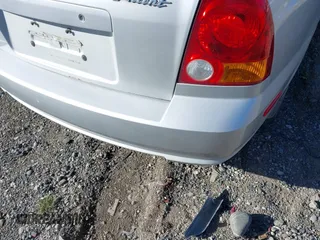2005 Hyundai Accent GLS z VIN KMHCG45C25U623618, wystawiony jako IAAI lot #42140996 z przebiegiem 184 852 mil mil oraz . Historia ofert i sprzedaży dostępna na DreamBid. Obrazek 16.