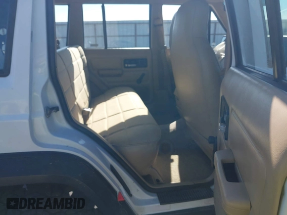 1995 Jeep Cherokee Sport with VIN 1J4FJ68S1SL576255, listed as a IAAI auction lot 42178902 with 214,041 mi miles and . Bid and sale history available at DreamBid. Image 8.