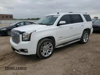 2015 GMC Yukon Denali z VIN 1GKS2CKJ8FR301800, wystawiony jako Copart lot #54874475 z przebiegiem 134 981 mil mil oraz Szkoda całkowita • Salvage title. Historia ofert i sprzedaży dostępna na DreamBid. Obrazek 1.