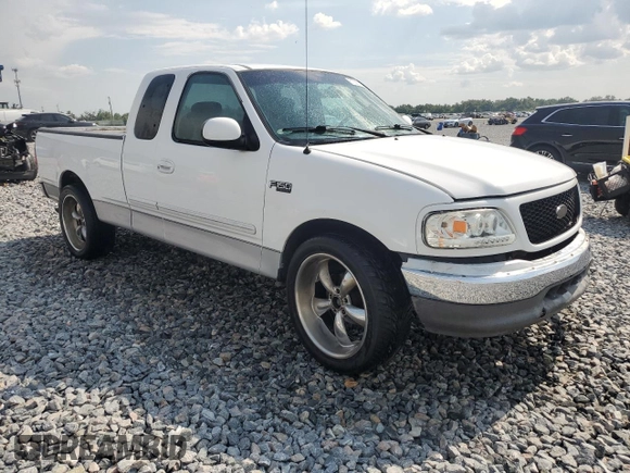 2002 Ford F-150 XL with VIN 1FTRX17272NB01218, listed as a Copart auction lot 61336795 with 201,972 mi miles and Salvage title. Bid and sale history available at DreamBid. Image 4.