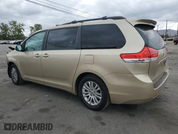 2011 Toyota Sienna XLE AAS with VIN 5TDYK3DC7BS110854, listed as a Copart auction lot 54604135 with 161,612 mi miles and Salvage Title. Bid and sale history available at DreamBid. Image 2.