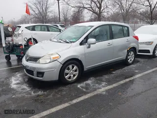 2009 Nissan Versa 1.8 SL with VIN 3N1BC13E59L420840, listed as a IAAI auction lot 41503232 with 129,824 mi miles. Bid and sale history available at carsss.com. Image 2.
