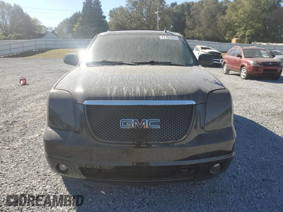 2011 GMC Yukon Denali with VIN 1GKS1EEFXBR121055, listed as a Copart auction lot 77194354 with 98,806 mi miles and Salvage Title. Bid and sale history available at carsss.com. Image 5.