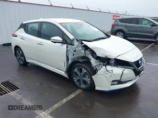 2020 Nissan LEAF SL Plus z VIN 1N4BZ1DP1LC310517, wystawiony jako IAAI lot #41974900 z przebiegiem 39 404 mil mil oraz . Historia ofert i sprzedaży dostępna na DreamBid. Obrazek 1.
