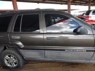 2004 Jeep Grand Cherokee Laredo with VIN 1J4GX48N64C436853, listed as a IAAI auction lot 41785918 with 118,578 mi miles. Bid and sale history available at carsss.com. Image 12.