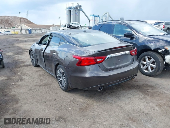 2016 Nissan Maxima SV with VIN 1N4AA6AP0GC904168, listed as a IAAI auction lot 41865822 with 121,999 mi miles and . Bid and sale history available at DreamBid. Image 3.