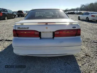 1997 Ford Thunderbird LX with VIN 1FALP62W0VH150654, listed as a Copart auction lot 86274524 with 119,203 mi miles and Salvage Title. Bid and sale history available at DreamBid. Image 6.
