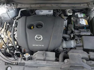 2020 Mazda CX-5 Touring with VIN JM3KFACM9L0785464, listed as a IAAI auction lot 42023311 with 90,062 mi miles and . Bid and sale history available at DreamBid. Image 10.