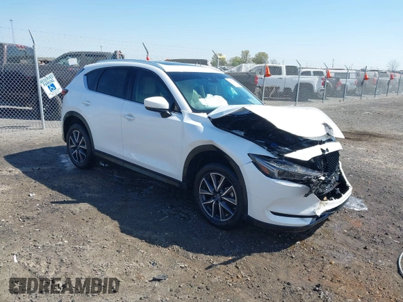 2018 Mazda CX-5 Grand Touring with VIN JM3KFBDM0J0404635, listed as a IAAI auction lot 41883068 with 71,178 mi miles. Bid and sale history available at carsss.com. Image 1.