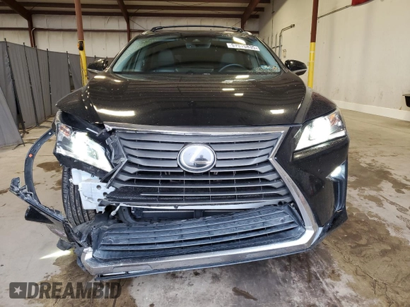 2016 Lexus RX 350 with VIN 2T2BZMCA3GC001679, listed as a Copart auction lot 57070835 with 74,729 mi miles and Salvage Title. Bid and sale history available at DreamBid. Image 5.