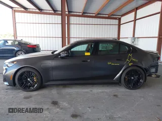 2025 BMW 5 Series with VIN WBS83FK04SCU11874, listed as a IAAI auction lot 42543784 with 4,517 mi miles and . Bid and sale history available at DreamBid. Image 14.