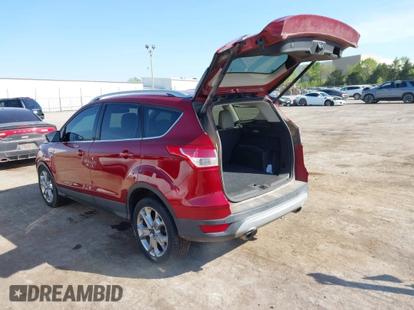 2014 Ford Escape Titanium with VIN 1FMCU0J91EUE12034, listed as a IAAI auction lot 42027493 with 160,417 mi miles and . Bid and sale history available at DreamBid. Image 3.