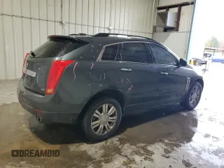 2015 Cadillac SRX z VIN 3GYFNAE34FS523702, wystawiony jako Copart lot #44706065 z przebiegiem 148 259 mil mil oraz Szkoda całkowita • Salvage title. Historia ofert i sprzedaży dostępna na DreamBid. Obrazek 3.