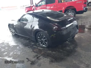 2016 Nissan 370Z with VIN JN1AZ4EHXGM935516, listed as a IAAI auction lot 41966014 with 92,147 mi miles. Bid and sale history available at carsss.com. Image 3.