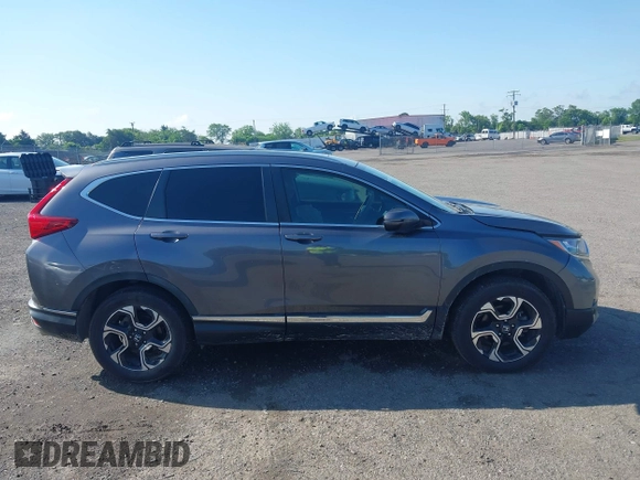 2018 Honda CR-V Touring z VIN 5J6RW2H93JL004834, wystawiony jako IAAI lot #42351364 z przebiegiem 63 746 mil mil oraz . Historia ofert i sprzedaży dostępna na DreamBid. Obrazek 13.