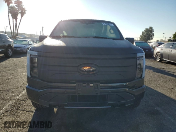 2023 Ford F-150 Lightning Pro with VIN 1FTVW1EL7PWG11261, listed as a Copart auction lot 64088925 with 3,288 mi miles and Salvage title. Bid and sale history available at DreamBid. Image 5.