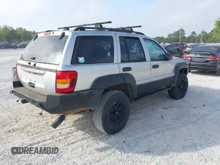 2003 Jeep Grand Cherokee Laredo z VIN 1J8GW48S33C519680, wystawiony jako IAAI lot #42126714 z przebiegiem 295 517 mil mil oraz . Historia ofert i sprzedaży dostępna na DreamBid. Obrazek 4.