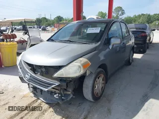 2010 Nissan Versa 1.8 S with VIN 3N1BC1AP0AL365397, listed as a IAAI auction lot 41987852 with 183,952 mi miles. Bid and sale history available at carsss.com. Image 2.