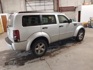 2007 Dodge Nitro SLT z VIN 1D8GU58K97W616455, wystawiony jako IAAI lot #41229813 z przebiegiem 199 421 mil mil oraz . Historia ofert i sprzedaży dostępna na DreamBid. Obrazek 4.