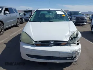 2004 Ford Focus SE z VIN 1FAFP34Z44W103852, wystawiony jako IAAI lot #42395073 z przebiegiem Nie podano mil oraz . Historia ofert i sprzedaży dostępna na DreamBid. Obrazek 12.